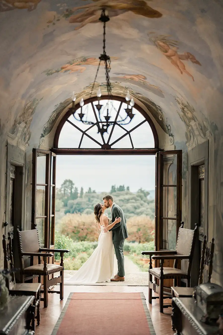 Bride and groom at a historic villa in the Tuscan countryside